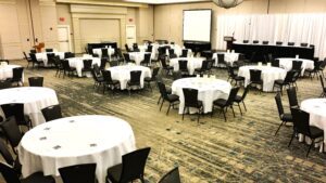 A room with many tables and chairs in it