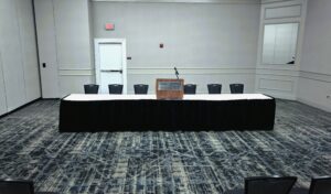 A conference room with a table and chairs