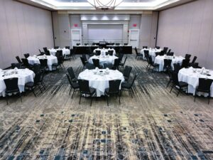 A large room with tables and chairs in it