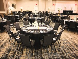 A large room with tables and chairs in it