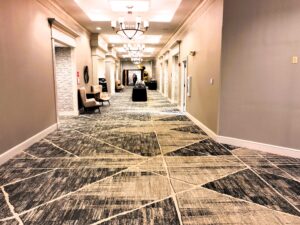 A hallway with many floors and lights in it