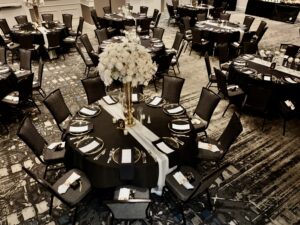 A large round table with many chairs around it