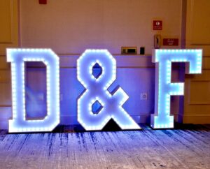 A large lighted sign that says d & f.