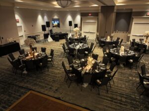 A room with many tables and chairs in it