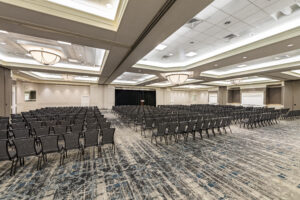 A large room with many chairs and tables