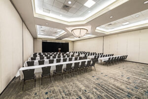 A large room with many chairs and tables