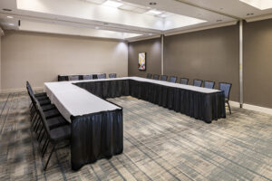 A large room with tables and chairs in it