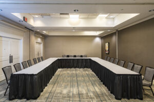 A large room with tables and chairs in it