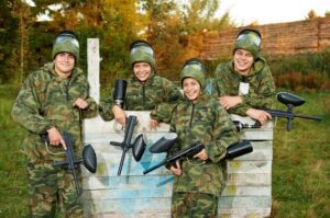 A group of people in camouflage holding guns.