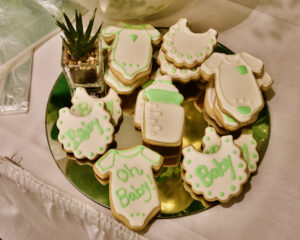 A beautiful decorated oh baby cookies kept on a plate